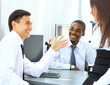 Portrait of happy business team having meeting in office