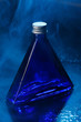 Little blue bottle on a background