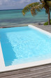 Photo: View of swimming-pool with sea in background View of swimming-pool with sea in background