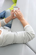 Upper view of man in sofa using smartphone