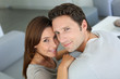 Upper view of sweet couple sitting in sofa