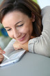 Young woman using smartphone at home