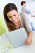 Woman at home looking at recipe on tablet