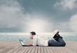 Man Using Laptop On The Beach