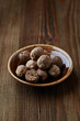 Whole nutmeg on a small plate
