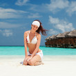 Cute woman relaxing on the beach