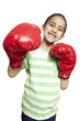 Young girl wearing boxing gloves smiling