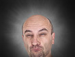 Skeptical man with funny grimace