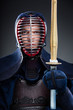 Portrait of kendoka with wooden sword