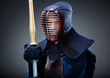 Portrait of kendo fighter with bamboo sword
