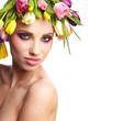 fashion model with large hairstyle and flowers in her hair.