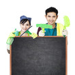 Photo: Cleaning service couple holding blackboard Cleaning service couple holding blackboard