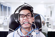 Photo: Stress businessman biting cables at office Stress businessman biting cables at office