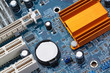 Part of the motherboard of the computer with battery and radiato