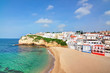 Portuguese villa in Carvoeiro beach with clear blue sea. In the