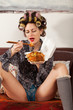 sexy girl eating spaghetti on the couch