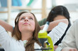 High School students. Beautiful girl relaxing at biology classro