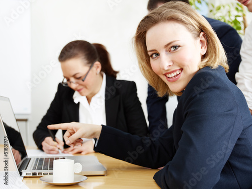 Photo: Business people are in a meeting and take the minutes Business people are in a meeting and take the minutes