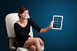 Photo: woman holding modern tablet with colorful icons woman holding modern tablet with colorful icons