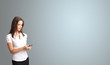 attractive woman holding a phone with copy space