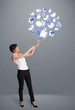 Pretty woman holding social icon balloon