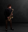 Young musician playing on saxophone