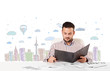 Attractive businessman with city sky-scape background