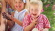 Children Enjoying Food At Party
