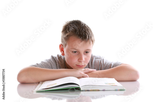 Photo: boy reading a book boy reading a book