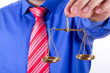 Businessman Shows Scales