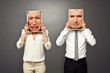 man and woman holding frames with sad faces