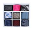 Neckties in wooden box isolated on white