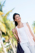 Happy woman walking in Miami