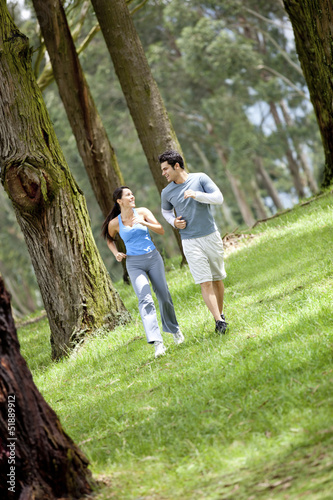 Photo: Couple running at the park Couple running at the park