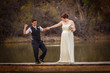 Photo: Smiling Cople Dancing Over Pond Smiling Cople Dancing Over Pond
