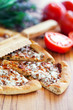 Pizza with tomato sauce, basil and cheese, selective focus