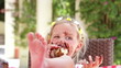 Girl Eating Messy Slice Of Chocolate Cake