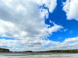 Clouds over the lake. Last snow. 4x3. Fixed geometry