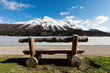 beautiful mountain landscape, lake ice, wooden bench