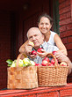 Photo: couple with baskets full of apples couple with baskets full of apples