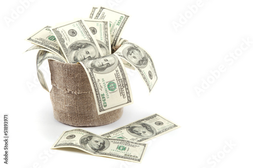 Photo: Hundred dollar bills in a canvas sack isolated on white backgrou Hundred dollar bills in a canvas sack isolated on white backgrou