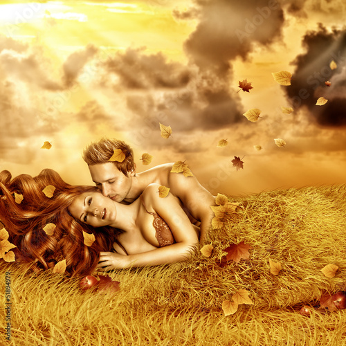 Photo: Loving fairy couple in a bed of grass Loving fairy couple in a bed of grass