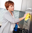 Woman cleaning kitchen