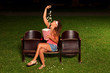 beautiful girl watch the film in outdoor summer cinema
