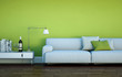 Sofa vor grüner Wand