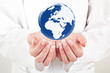 doctor woman holding globe on her hands