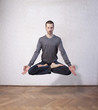 young man levitating in yoga position, meditation