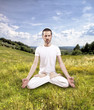 young man practicing yoga outdoor, lotus poition
