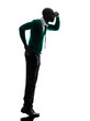 african black man standing tiptoe looking away silhouette