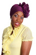 Beautiful african woman with purple headscarf.